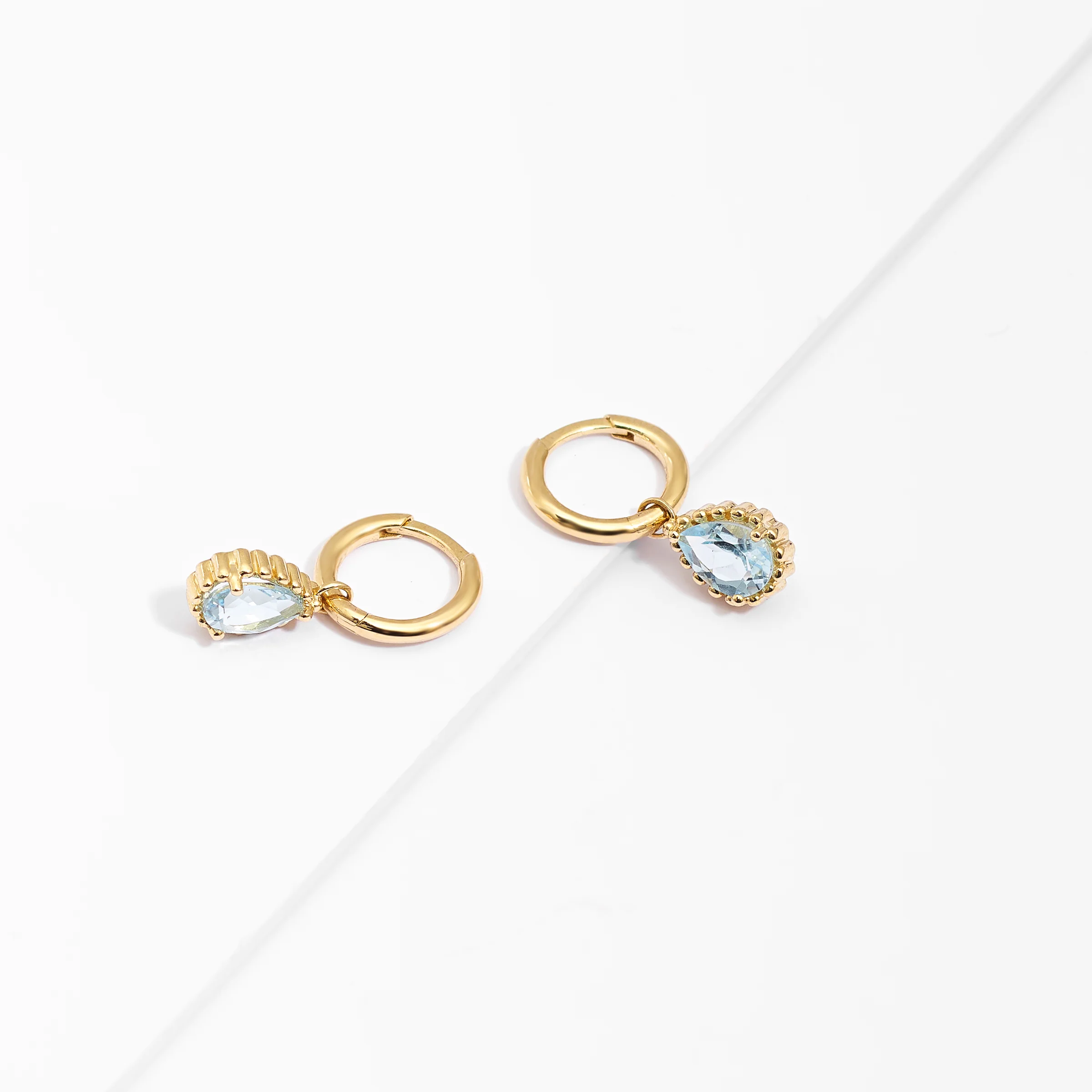 9K Yellow Gold Huggie Earrings With Dangling Blue Topaz Pear - Image 3