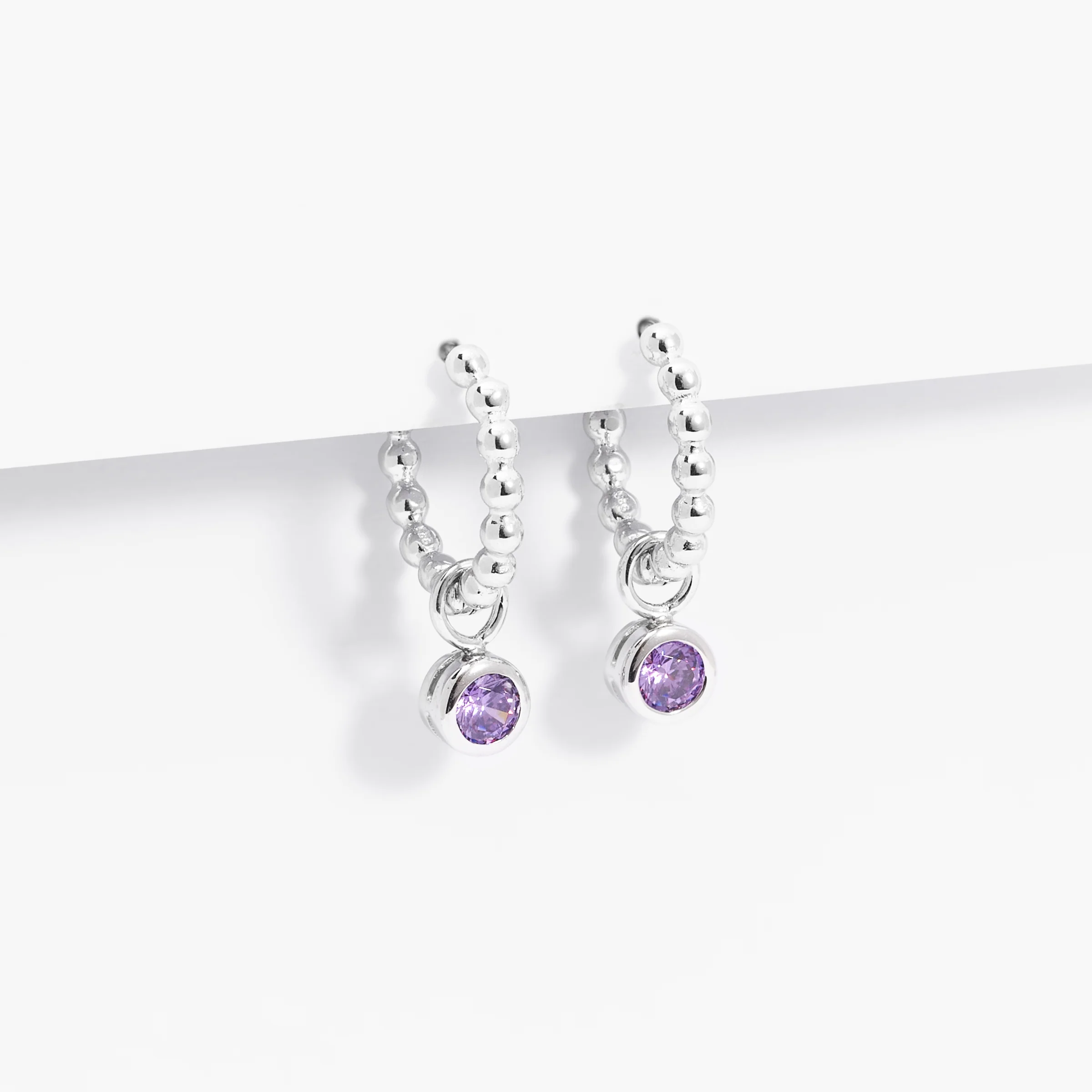 Sterling Silver Beaded Huggie Earrings With Purple Zirconia February Birthstone Drop - Image 2