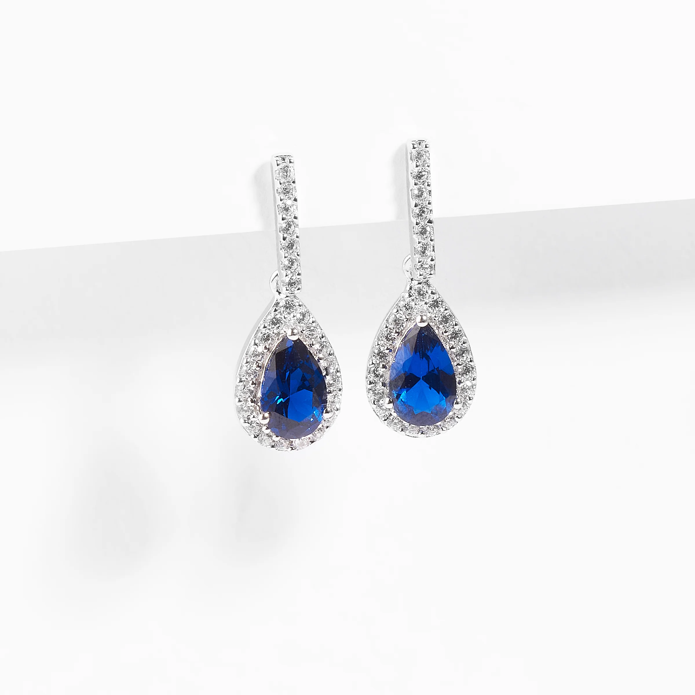 Sterling Silver Blue Pear Zirconia Halo Earrings - Image 2