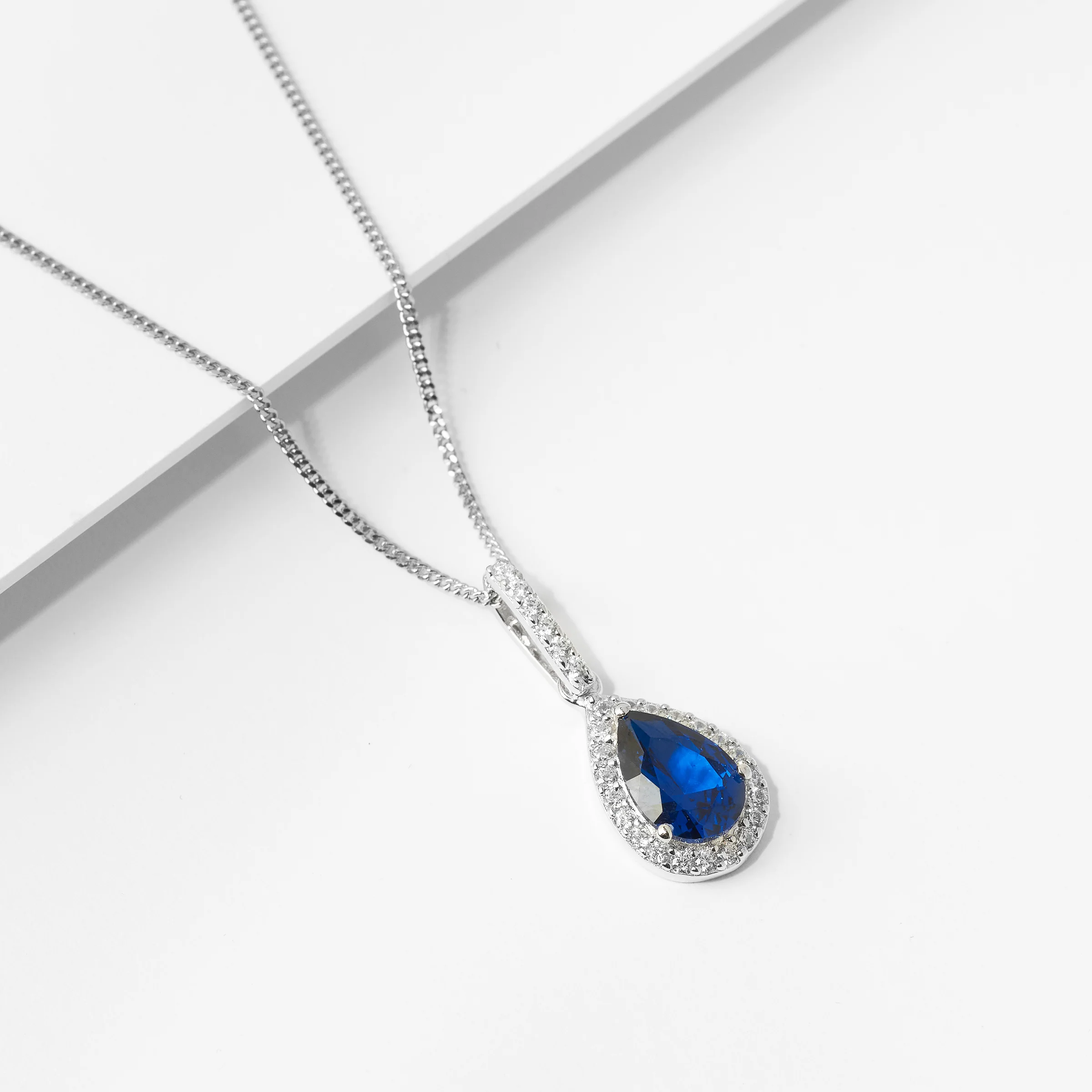 Sterling Silver Blue Pear Zirconia Halo Pendant - Image 2