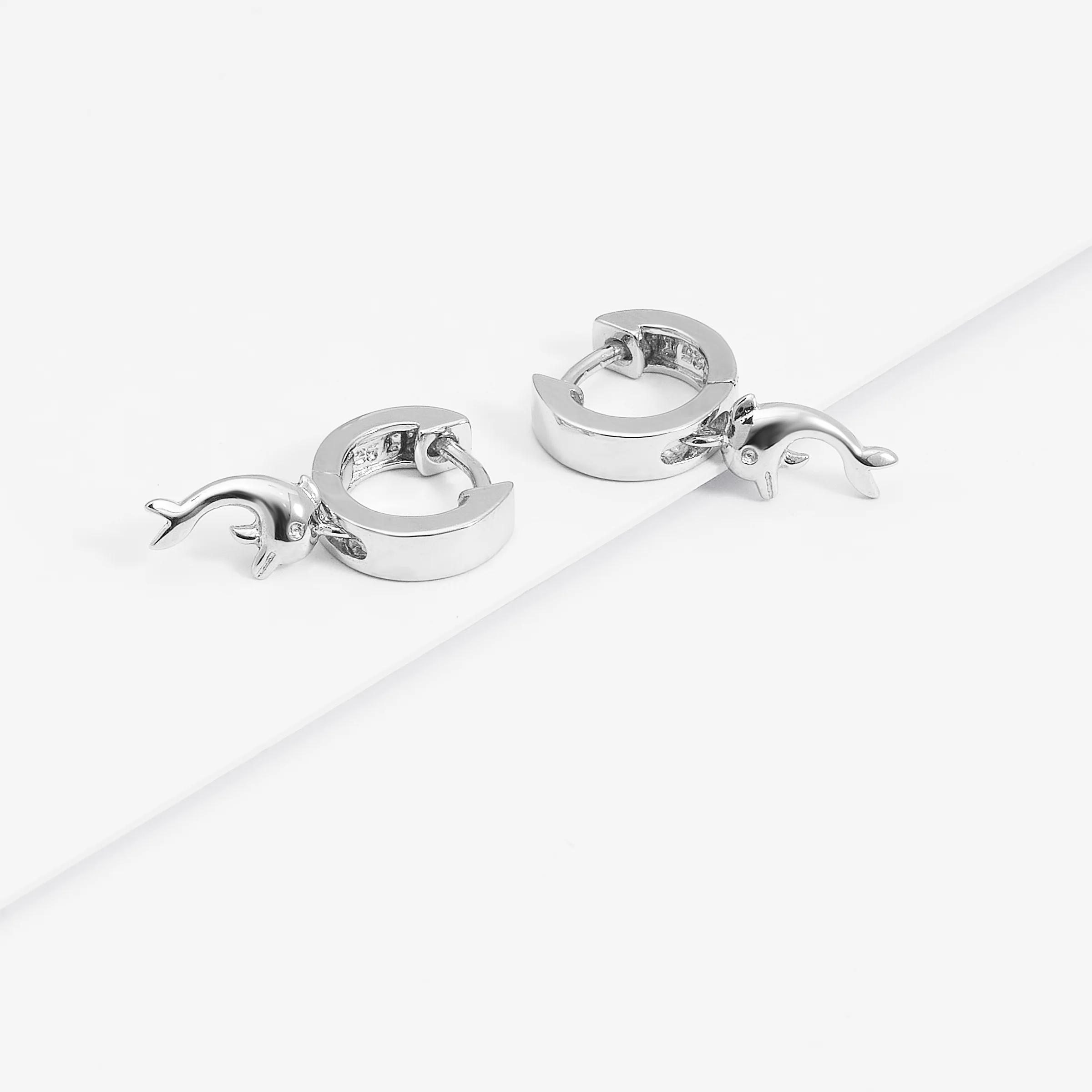 Sterling Silver Huggie Earrings With Dangling Dolphin - Image 3