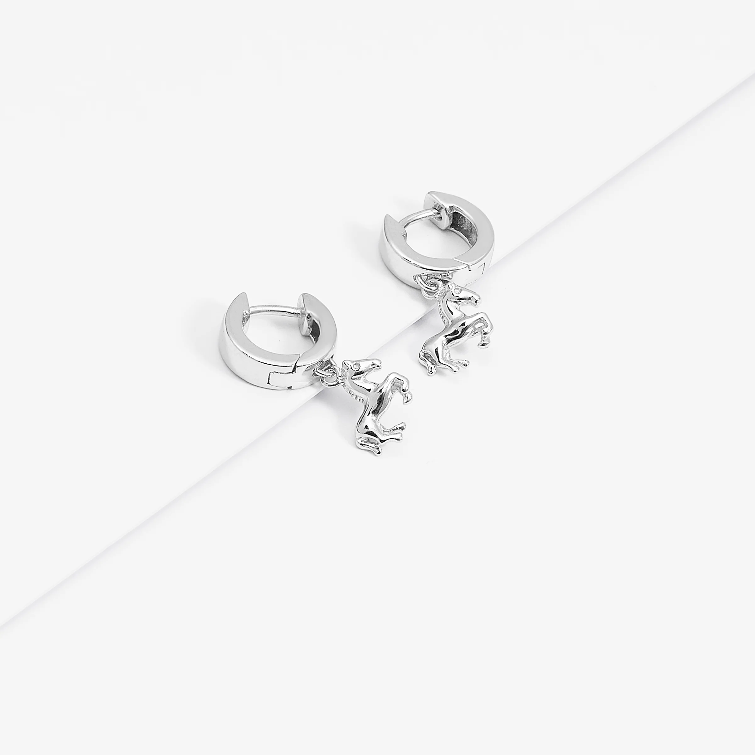 Sterling Silver Huggie Earrings With Dangling Horse - Image 3