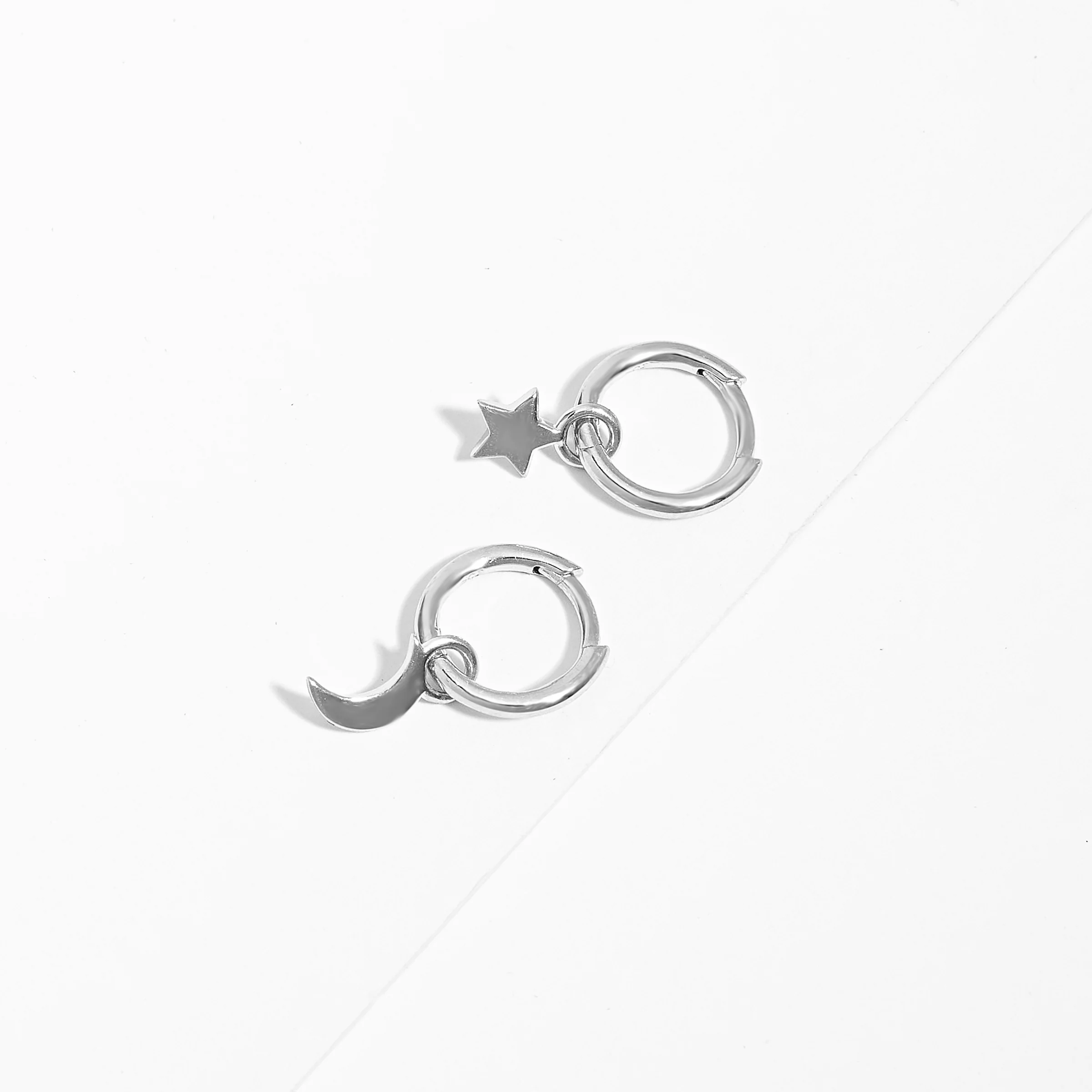 Sterling Silver Huggie Earrings With Dangling Star And Moon - Image 3