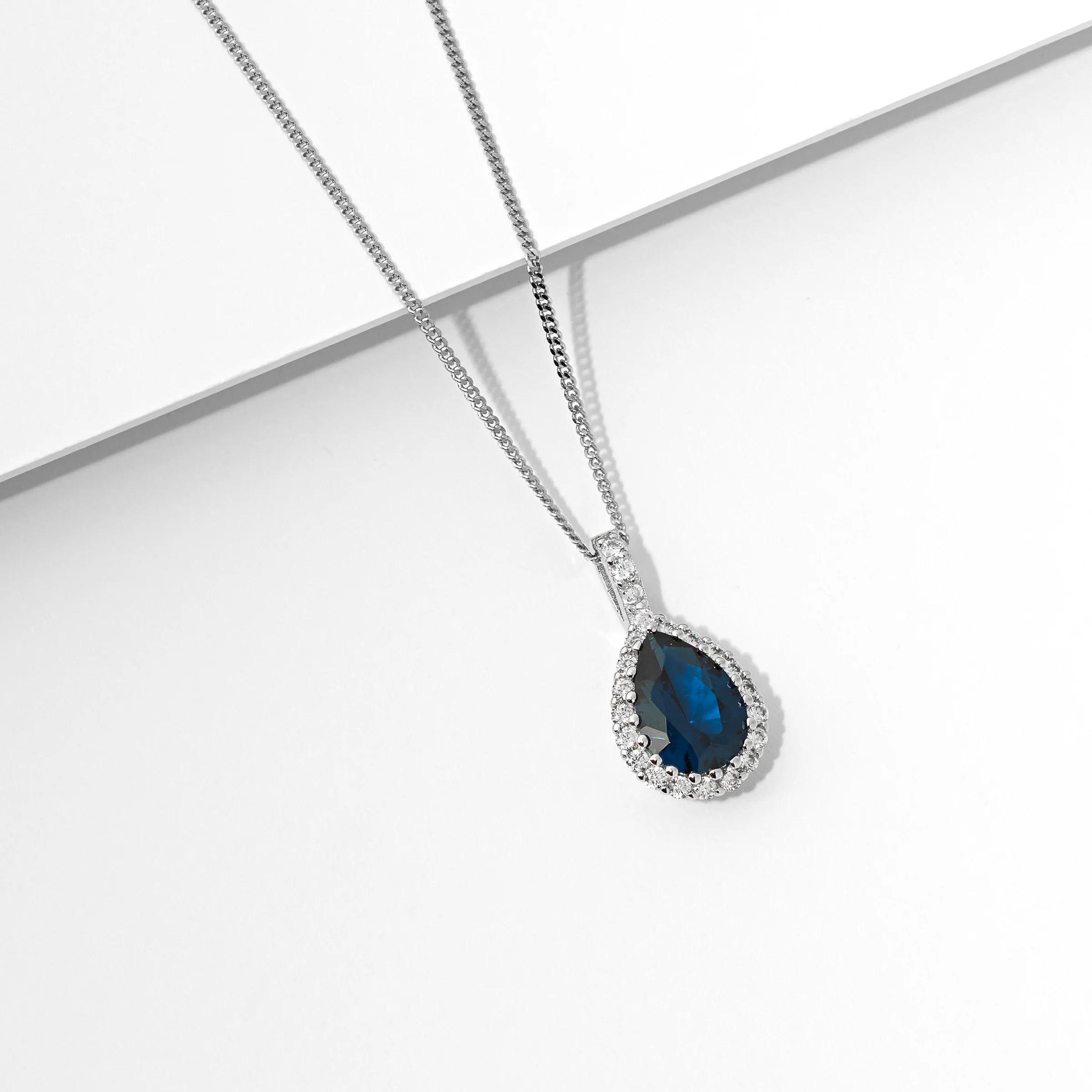 Sterling Silver London Blue Pear And Zirconia Halo Pendant - Image 2