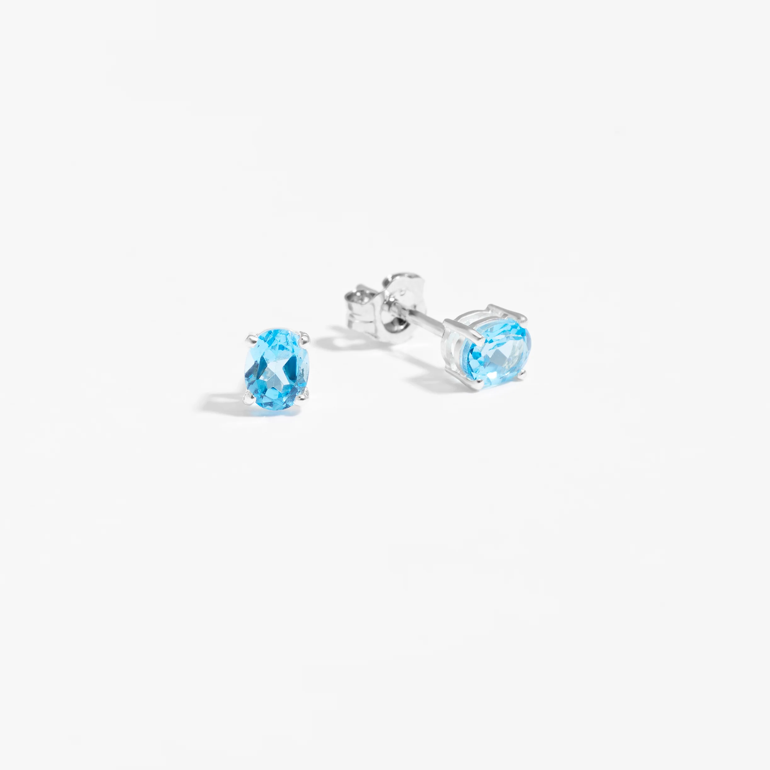 Sterling Silver Oval Swiss Blue Topaz December Birthstone Stud Earrings - Image 2