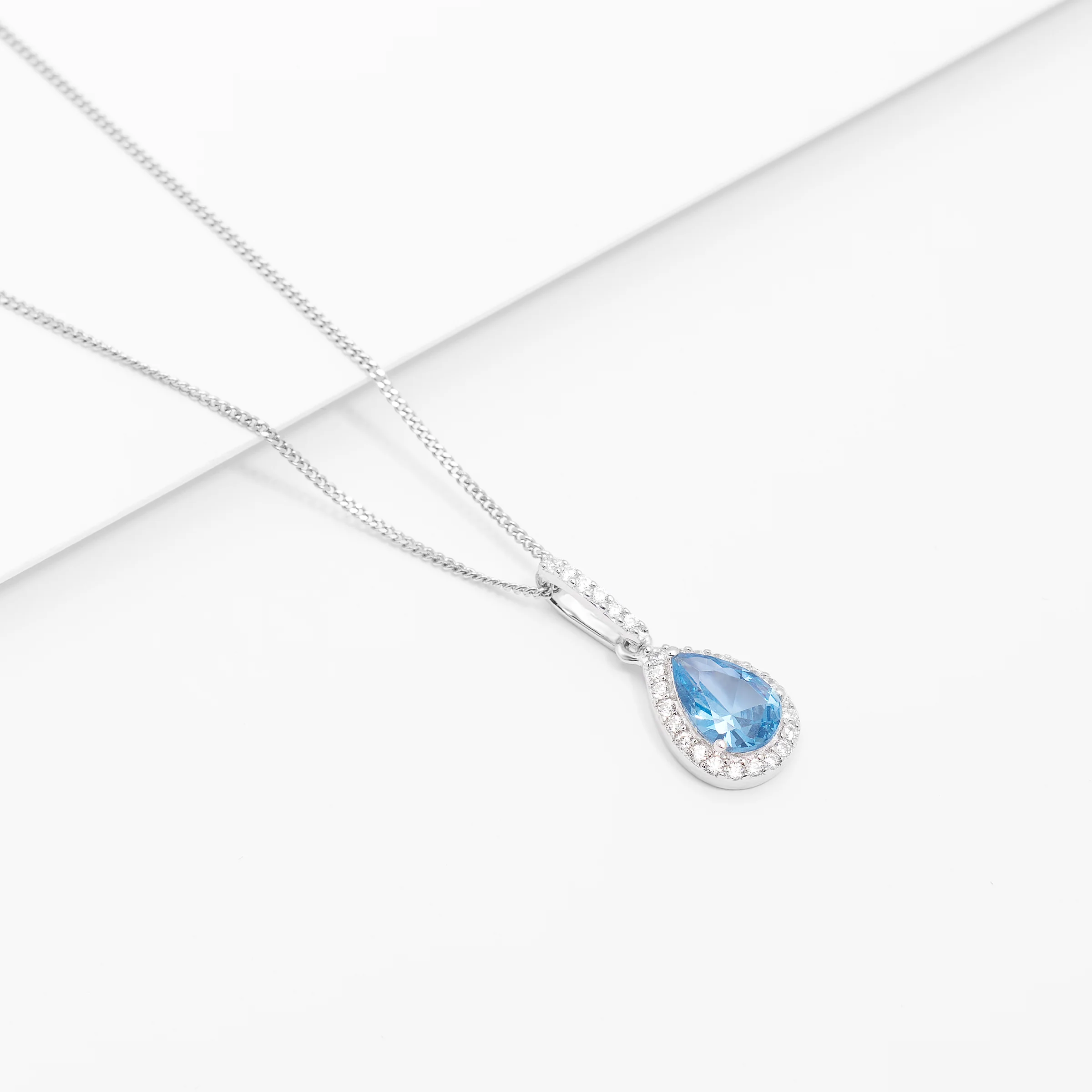 Sterling Silver Pale Blue Pear Zirconia Halo Pendant - Image 4